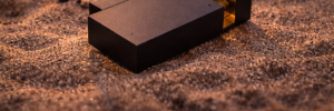KNNOX brass lighter on sand at sunset