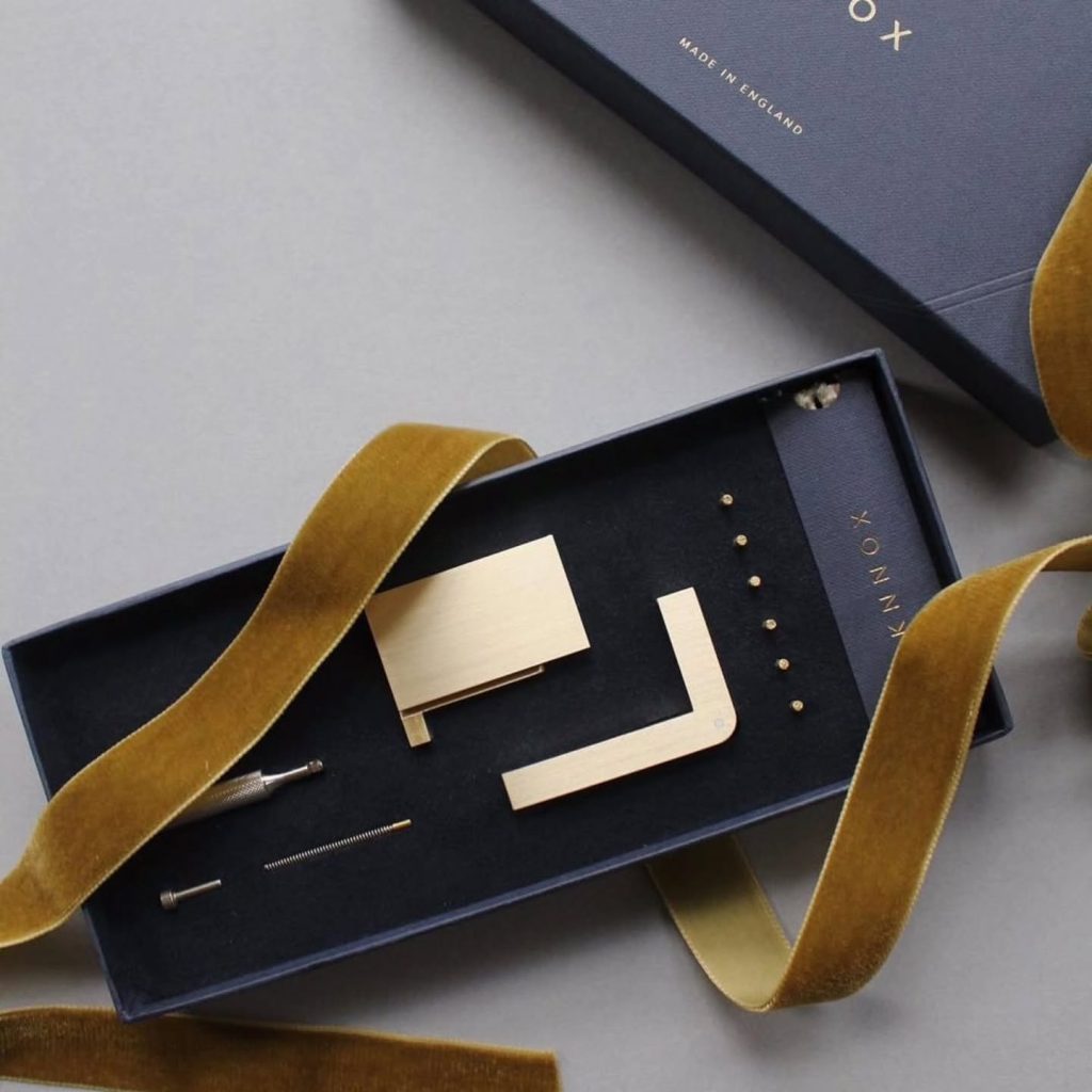 KNNOX brass lighter kit presented as a refined luxury gift object